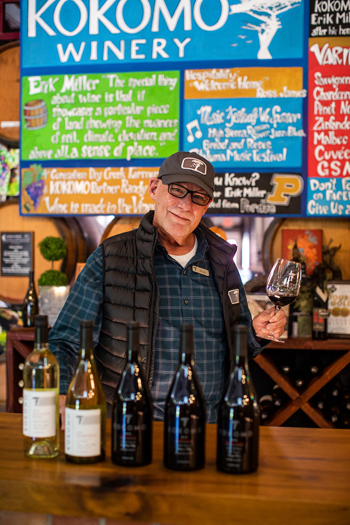 Ross pouring wine at the Kokomo Winery tasting room
